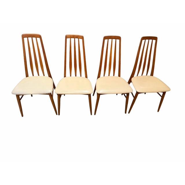 An exceptional, iconic set of four "Eva" high-back dining chairs, designed by Niels Koefoed in 1964 and manufactured by...