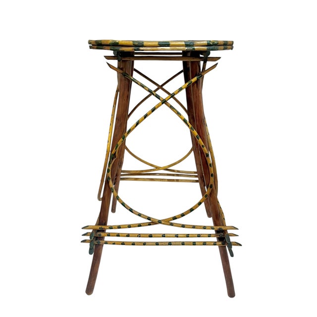 Charming rustic twig side table crafted in the classic Adirondack folk art tradition. This unique piece features a...