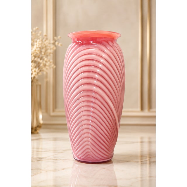 Add a sophisticated pop of color to your space with this striking vintage pink art glass vase. Featuring an elegant...