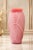 Add a sophisticated pop of color to your space with this striking vintage pink art glass vase. Featuring an elegant...