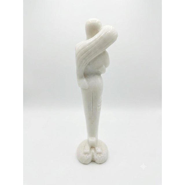 Elevate your space with this captivating mid-century modern abstract sculpture. Expertly carved from a beautiful, natural...
