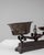 This 19th Century French iron scale displays a compelling blend of utilitarian design and sculptural presence, marked by...
