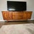 A beautifully restored Mid-Century Modern walnut credenza by Younge Furniture Company, showcasing the refined...