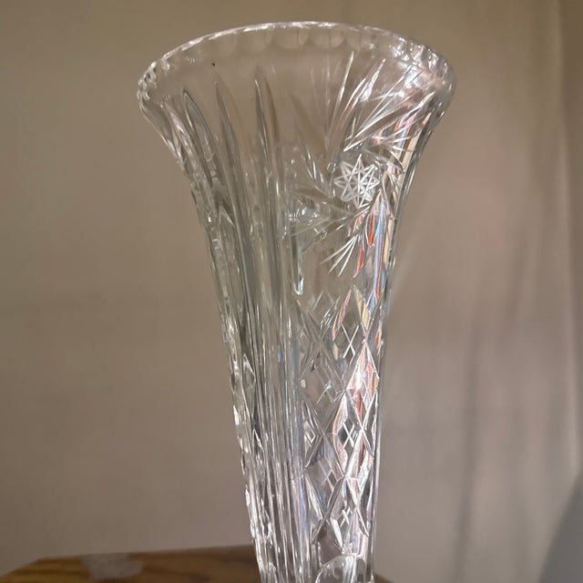 Elegant Bohemian crystal bud vase featuring finely executed star-cut detailing throughout the body. Handcrafted in the...