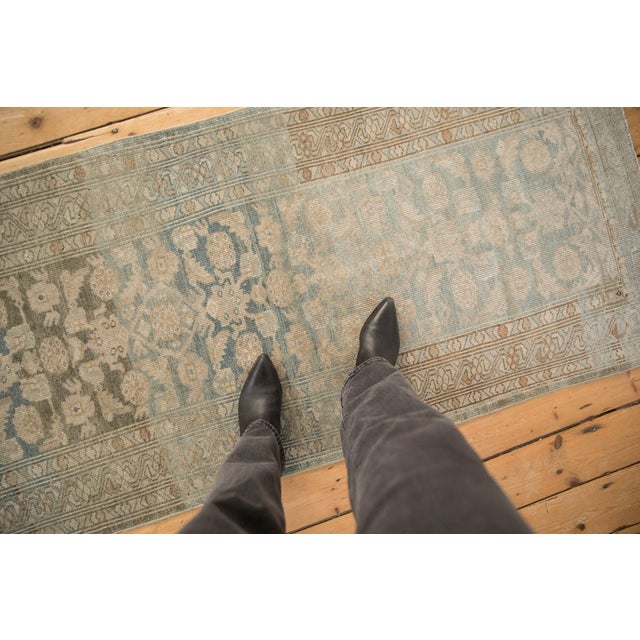 :: Allover covered Herati main field with abrashes across. Main border in a reciprocating meandering vine and blossom...