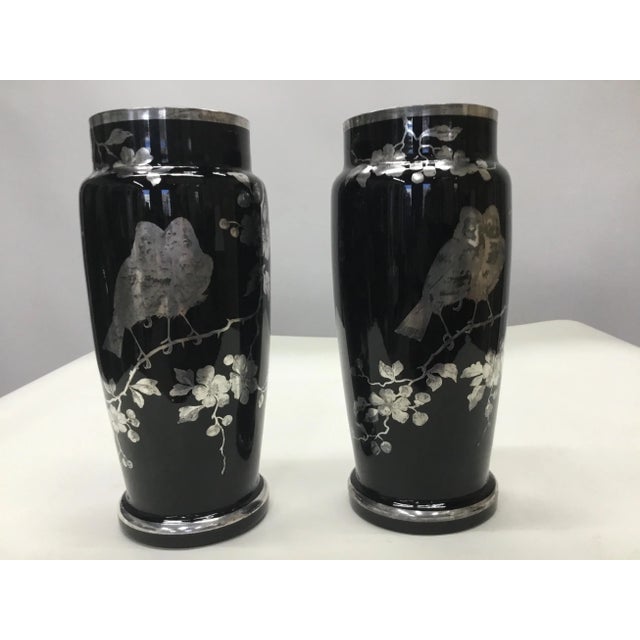 Beautiful pair of vintage vases with intricate design of apple blossoms and birds in silver overlay . No chips or cracks ,...