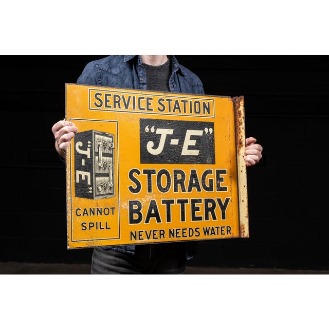 Early 20th-century double-sided flanged advertising sign for Jelly-Electrolyte Battery Co., Inc. of New York. Designed for...