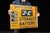 Early 20th-century double-sided flanged advertising sign for Jelly-Electrolyte Battery Co., Inc. of New York. Designed for...