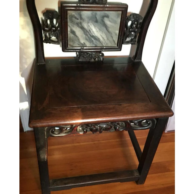 Antique 19th c. Chinese Qing carved hardwood chair with inset dreamstone. Yoke crested back above marble tablet surrounded...