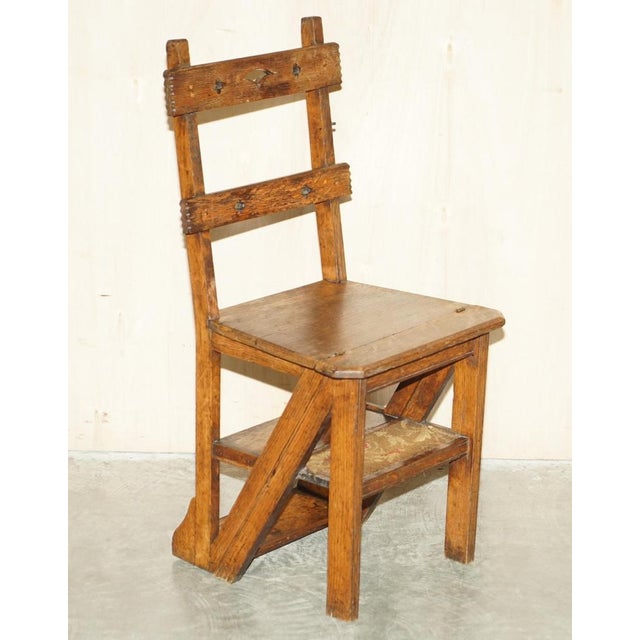This lovely antique Arts & Crafts Victorian metamorphic library steps chair in oak with period upholstered Rug steps A...