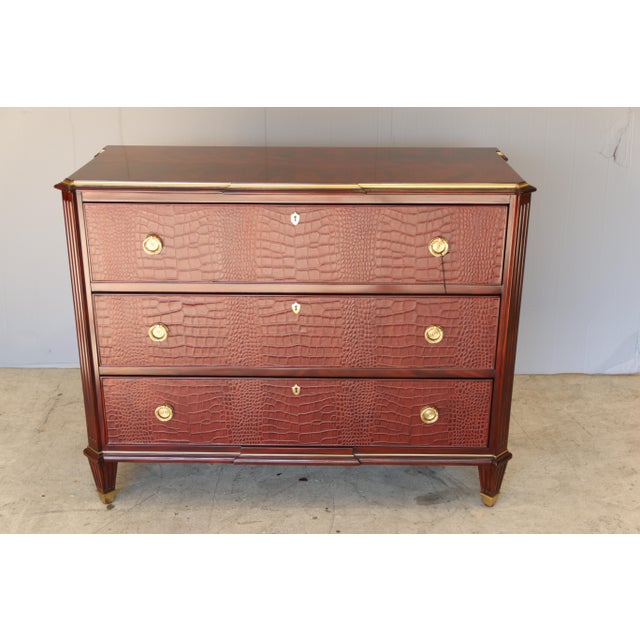 The Yeardley chest updates the classic three-drawer silhouette with modern design elements, including embossed leather...