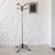 Chrome-plated metal axle, eight arms on two levels of twisted wrought iron topped with burgundy Bakelite balls. Base with...