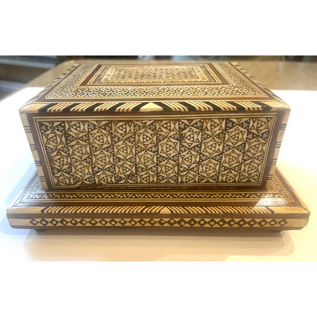 Beautiful mix woods with mosaic mother of pearl inlaid in multiple patterns and designed inlaid box. This unique music box...