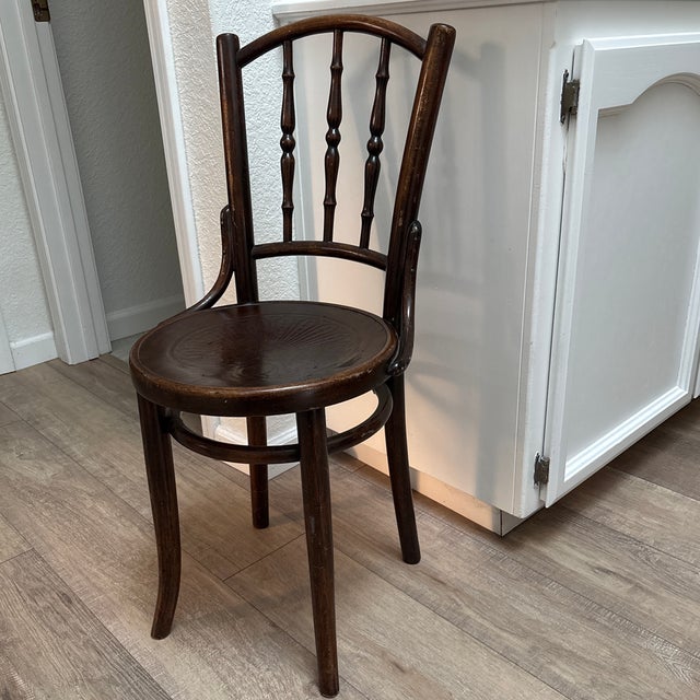 Rare vintage 1920s Thonet Bentwood accent or dining chair. Made in Vienna. Solid dark chocolate toned wood with swirled...