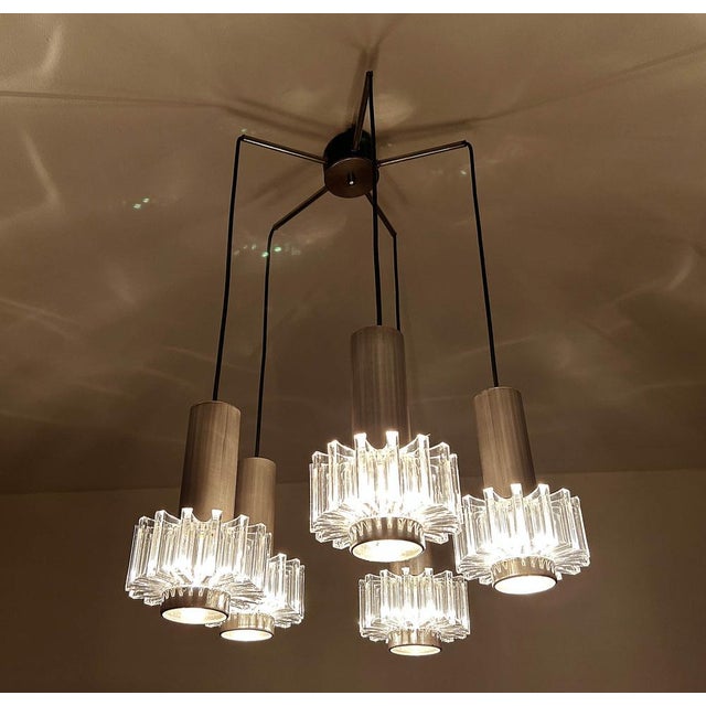 Vintage Cascade style pendant light featuring 5 separate lights with a large chrome finial and shades made of plexiglas...