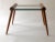 A simple, elegant table, designed by Max Kment, in the 1950s, and produced by Kunstgewerbliche Werkstätten in Austria. The...