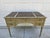This Baker Furniture writing desk features a distressed light green and black finish and has five drawers. The desk has...