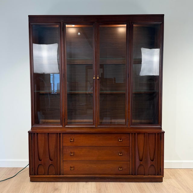 Broyhill Brasilia walnut buffet and hutch, featuring their iconic sculpted wood accents on the doors, solid brass...