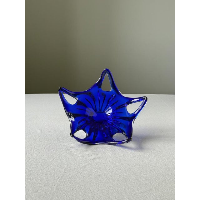 Elegant pair of sculptural hand-blown art glass bowls produced in Czechoslovakia during the mid-20th century. Crafted from...