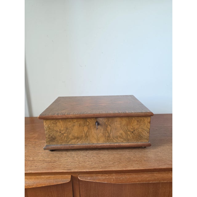 Measurements 12 × 8 × 4 in (30.5 × 20.3 × 10.2 cm) Weight: 1550 g (3.42 lb) Materials Walnut veneer Burl wood veneer...