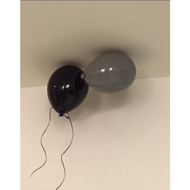 Add a unique sense of individuality into your space with this stylish ceramic Grey balloon wall sculpture. Handcrafted...