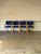 These four armchairs feature curved wooden frames paired with vibrant blue upholstery. Originating from Denmark, they...