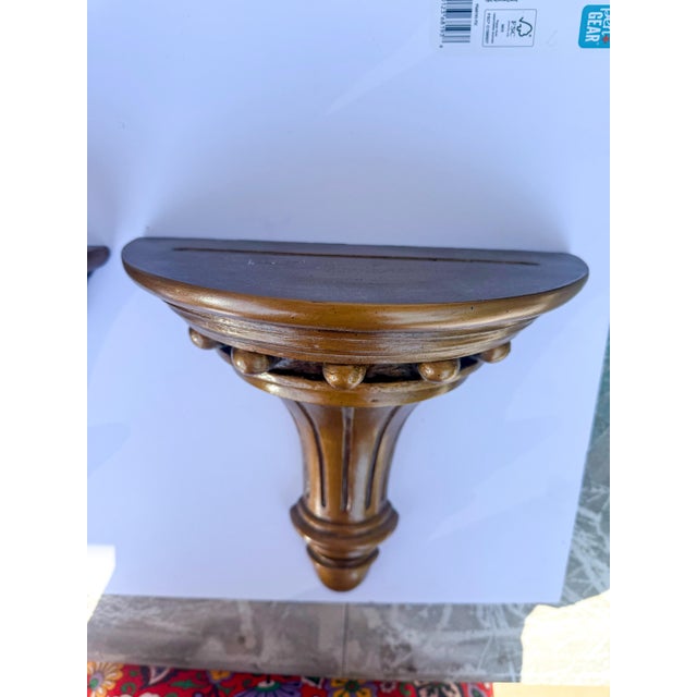 This is a pair of Federal style gilt composition wall brackets. They have an indentation for plates. They are unmarked and...