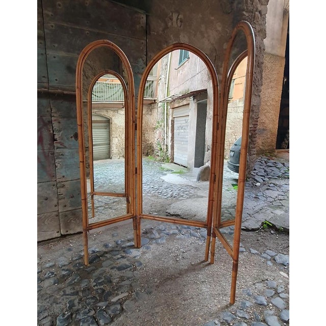 A room divider from the 1960's made from bamboo and mirror glass. Beautiful arched handmade screen from 3 panels made from...