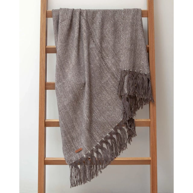 This "Double" throw is extremely soft and elegant, made by hand of 100% baby llama wool and silk, with special details...
