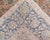 An early 20th century Persian Tabriz rug, the dusty rust field with an allover trellis design of palmettes and flowering...