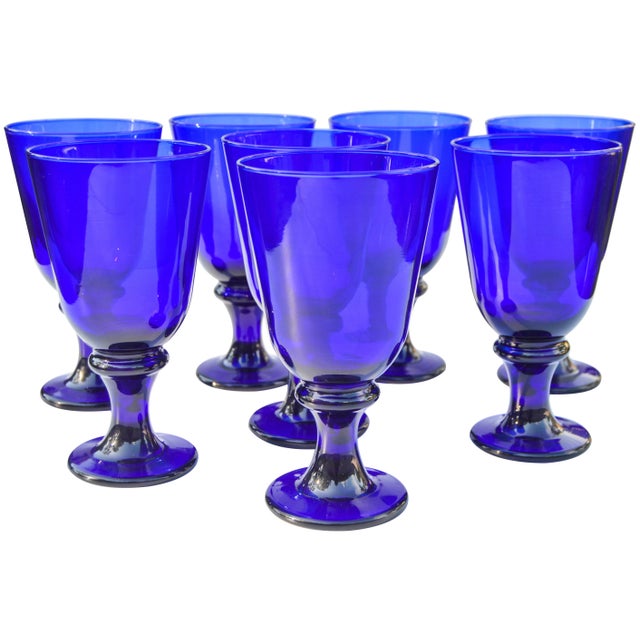 Set of eight midcentury cobalt blue crystals with ornate base and stem. This gorgeous set ships within 1-2 business days...