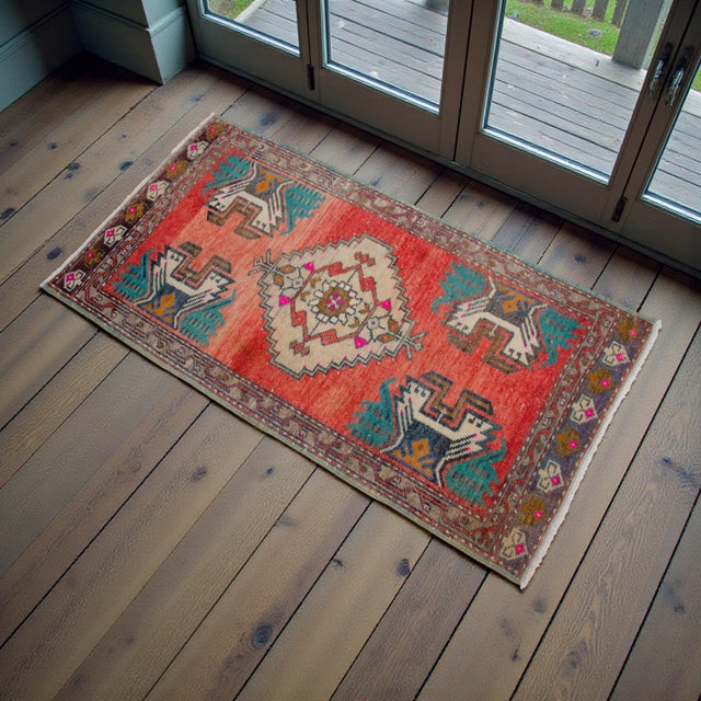 Vintage Turkish hand-knotted small rug from Nigde, 1970, featuring warm coral tones and authentic village craftsmanship —...