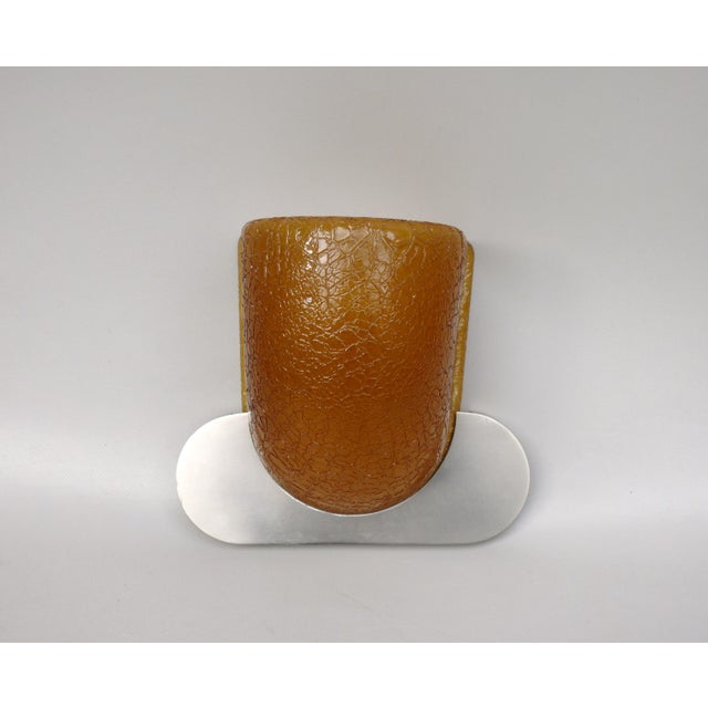 An exceptional and rare wall lamp, crafted in the minimalist Art Deco style, manufactured by WMF, Germany. The lamp is...