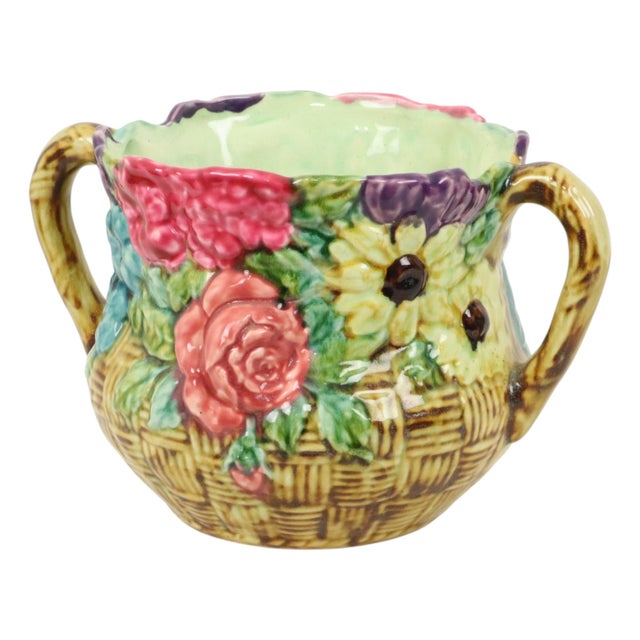 A beautiful and colorful Art Nouveau flower pot or cache-pot, crafted from polychrome-glazed majolica earthenware with a...