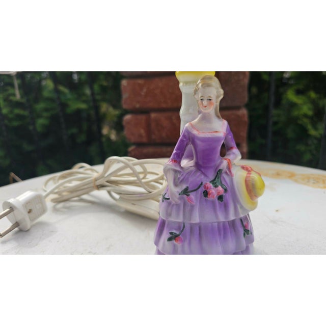 Art deco, porcelain lamp, lady with flowers, dimensions: height: 32 cm, diameter: 16 cm. European Plug (up to 250V).The...