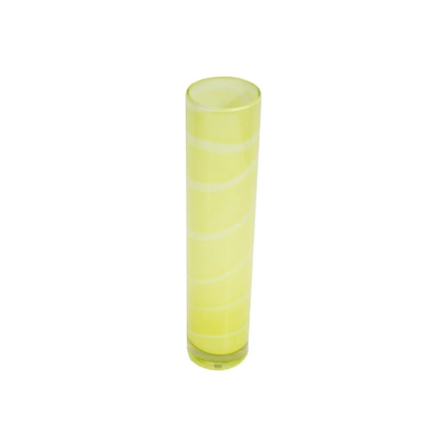 A yellow glass ﻿Samoa vase designed by Swedish glass artist Anne Ehrner (born 1948) for Kosta Boda. The tall cylindrical...