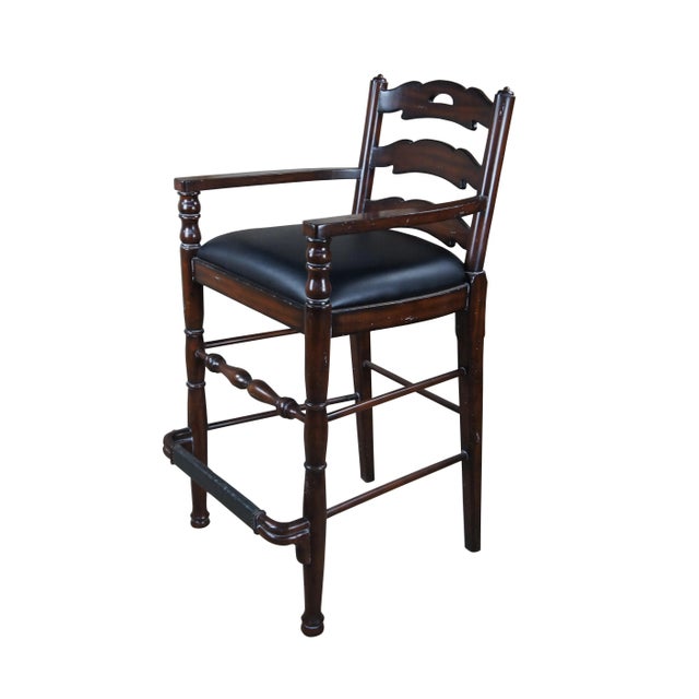 Maitland Smith Hunt Club Bar Stool, #985. Features a mahogany frame with ladderback and black leather seat. Includes...