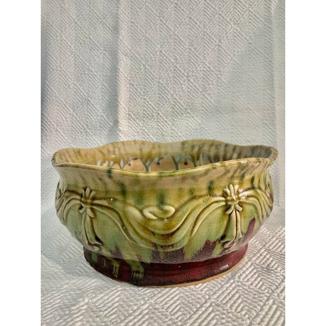 For the Weller or Roseville Pottery collectors, we have found this green and burgundy drip glazed center bowl or...