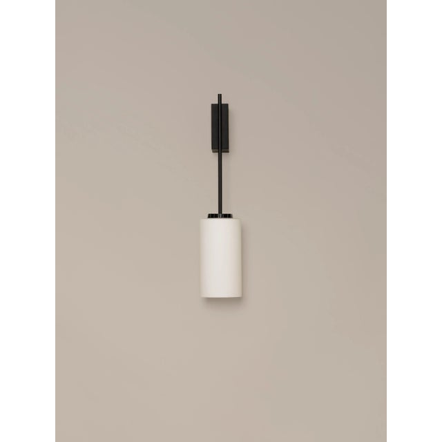Glass cirio wall lamp by antoni arola dimensions: d 11 x w 14 x h 54 cm materials: metal, white opal glass. The wall...
