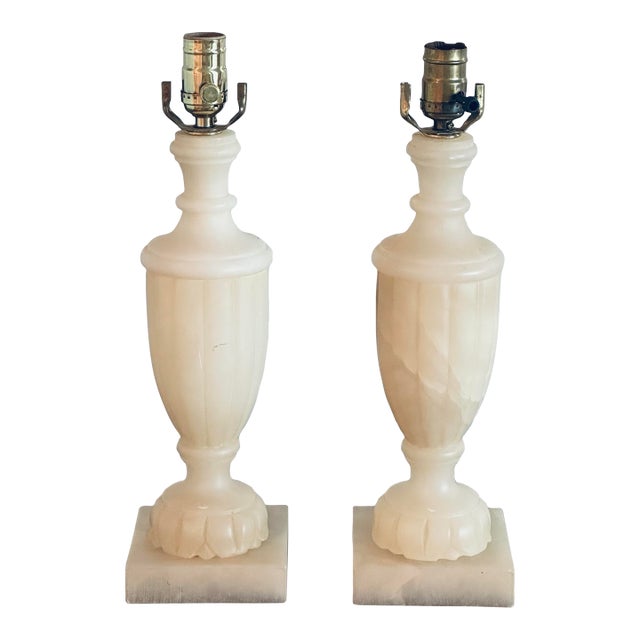 Elegant neoclassical style slender lobed urn form lamps with Sarreid sticker label to underside. Hand carved in Spain, the...