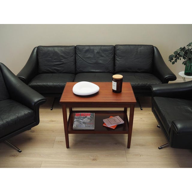 The coffee table was made in the 1960s, designed by Danish design icon Ole Wanscher. The table top is covered with...