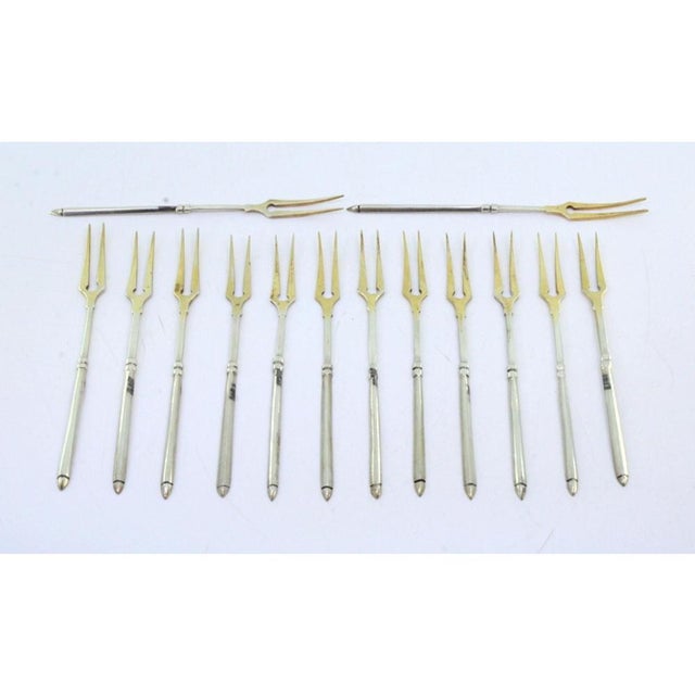 Gilded Silver Pickle Forks with Raised Handles, Set of 12, in Very Good conditions. Designed 1920 to 1949 This piece has...