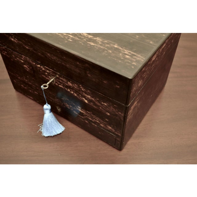 A rare and high-quality English Coromandel wood traveling case (vanity box) having a lovely dark appearance similar to...