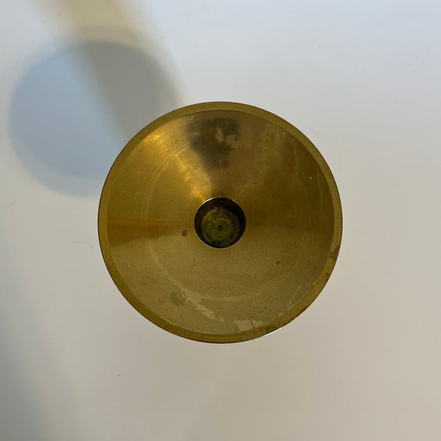 Brass candle holder, for both tapered and pillar candles. Tall base is 2" wide.