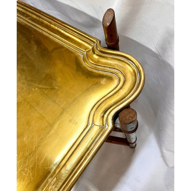 Large bamboo base coffee table with scalloped edge double handle brass tray. Cross tie design for stability and design...