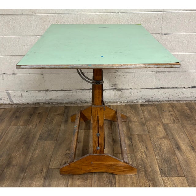 This is a stunning vintage, possibly antique, wood (believed to be oak and birch) adjustable drafting table or desk with...