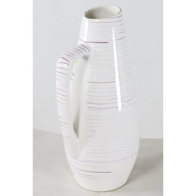 Beautiful unique large West Germany vase. The vase is in beautiful vintage condition but has some damage on the top, as...