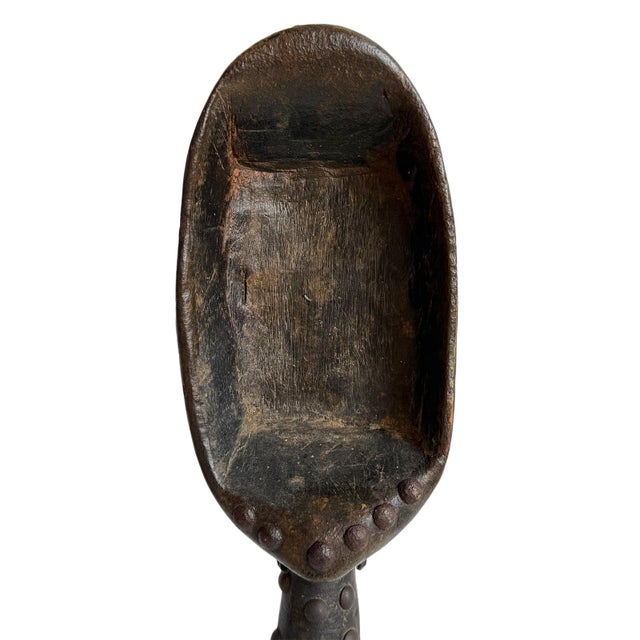 Old hand-carved Dan ceremonial spoon from Western Africa. Crafted from a single piece of dark hardwood with a richly aged...