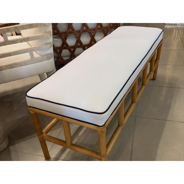 Vintage 1970s Palm Beach rattan bench. Newly upholstered Sunbrella white & Navy. All new insides, foam, etc. New feet on...