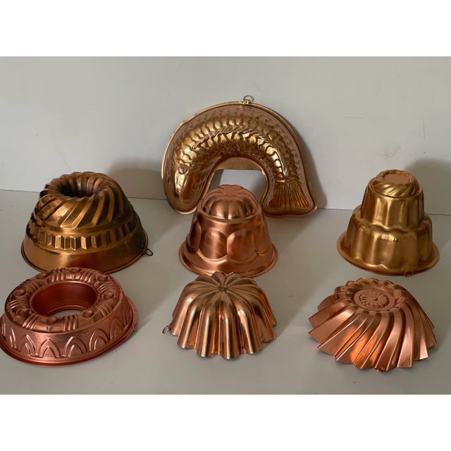 Vintage set of 7 copper baking. Jelly molds. And 6 cookie cutters.Collectible and decorative kitchenware.